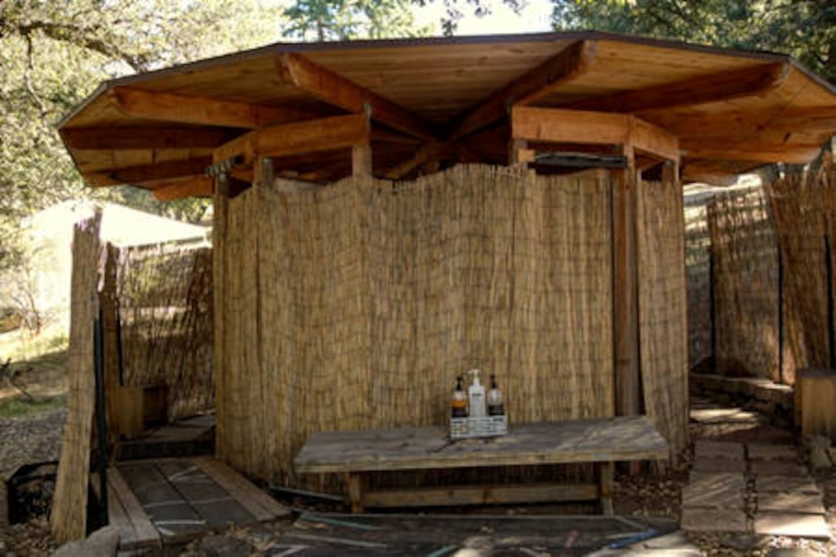 Outside shower hut with 4 stalls