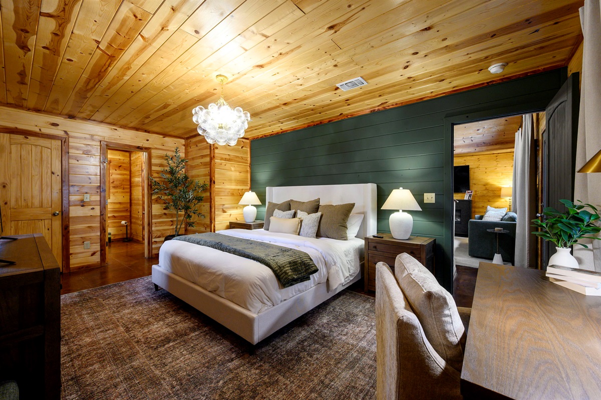 Master Bedroom Retreat:
Drift off where wood tones meet plush linens; a restful escape after a day of adventure. Sweet dreams included. ✨