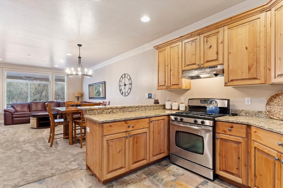 Another view of the open kitchen highlights its thoughtful layout and seamless integration with the main living space.