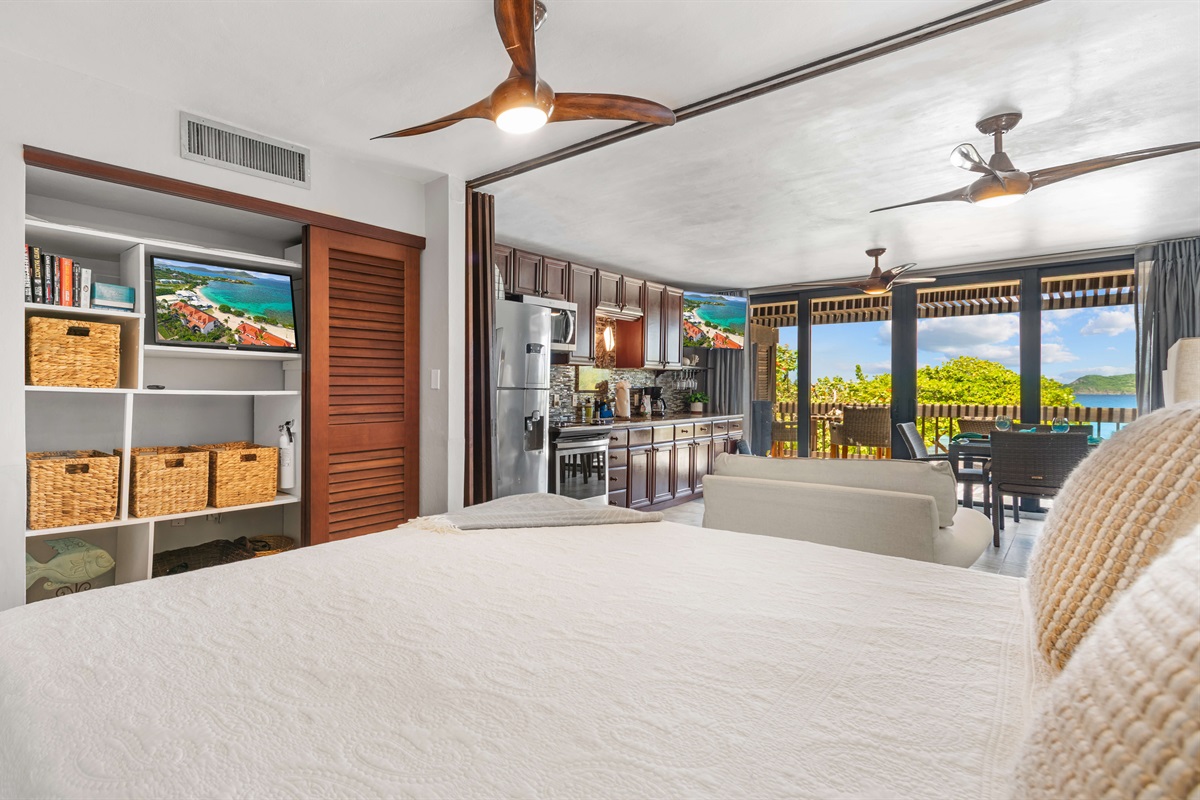 The king size bed can be open to the space, allowing for natural light 