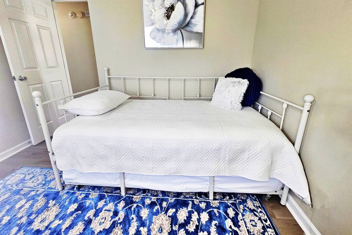 2 twin beds. There is a trundle bed underneath the day bed. 