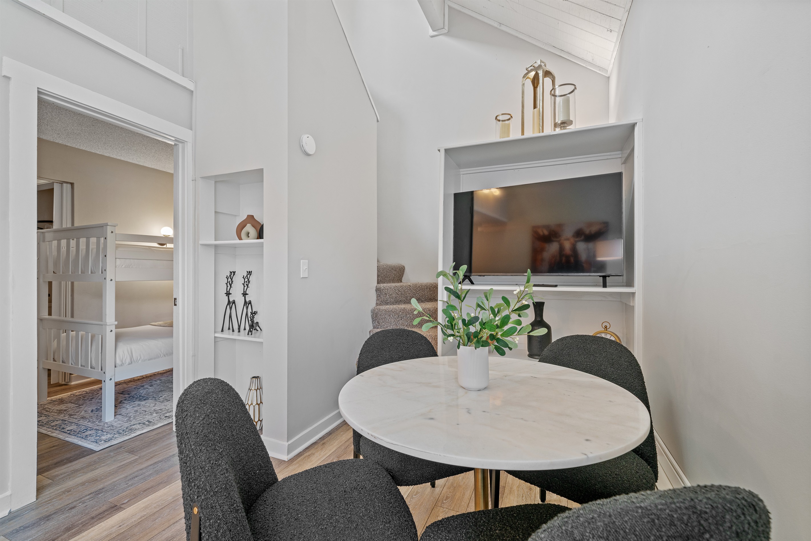 The luxurious dining table seats four comfortably