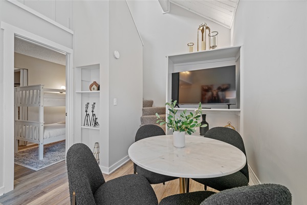 The luxurious dining table seats four comfortably