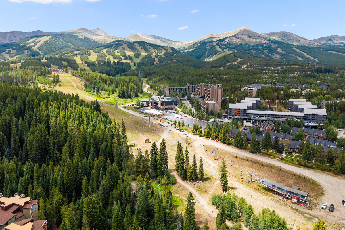 Aerial view of Peak 9 at Breckenridge Ski Resort with Main Street Station and The Village seen center right in photo. The QuickSilver chairlift is bottom right. Columbine Pine Creek Retreat is out of photo to the left. 