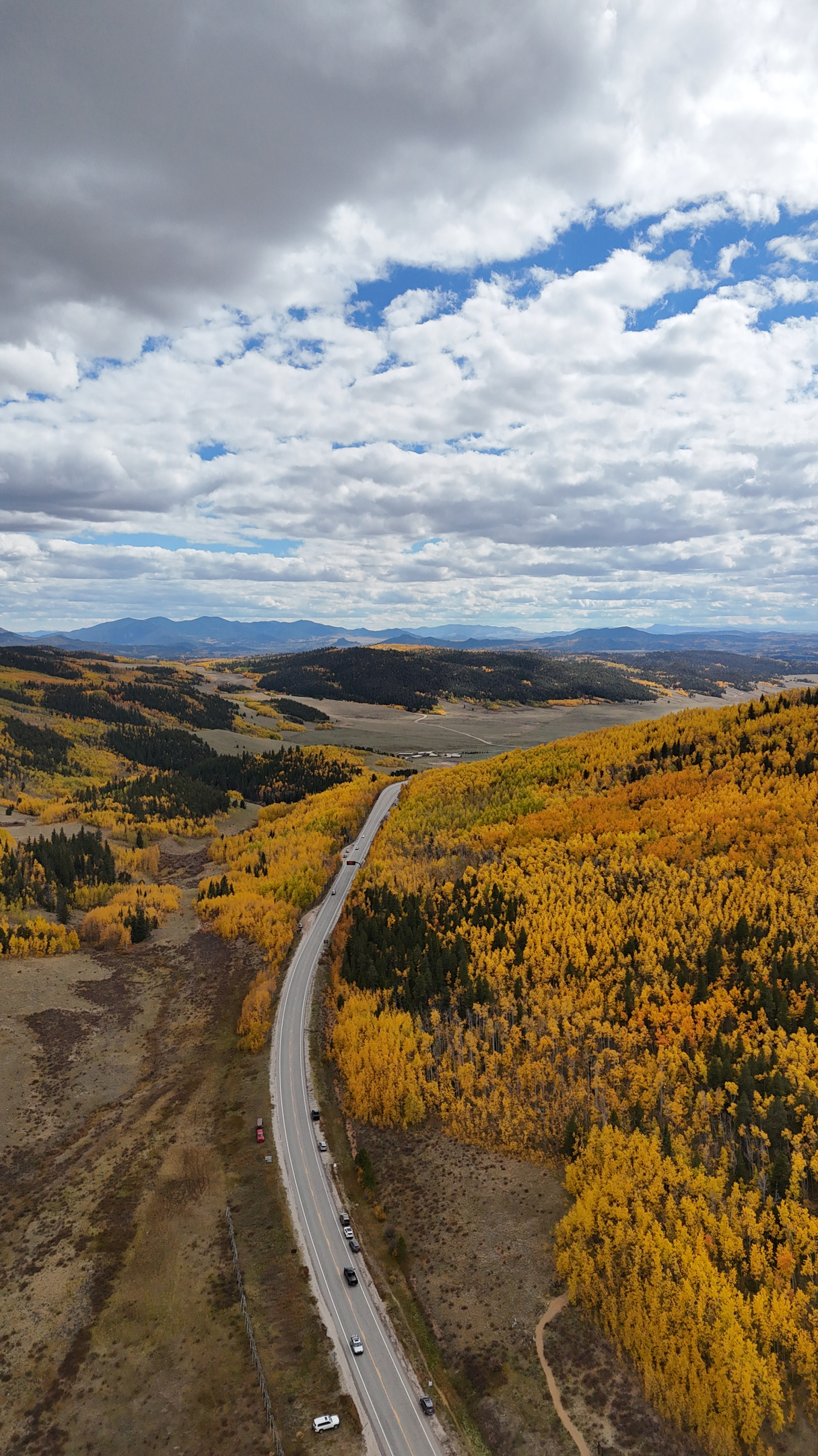 Breathtaking aerial shots of vibrant autumn aspen groves and changing mountain foliage in the local area.