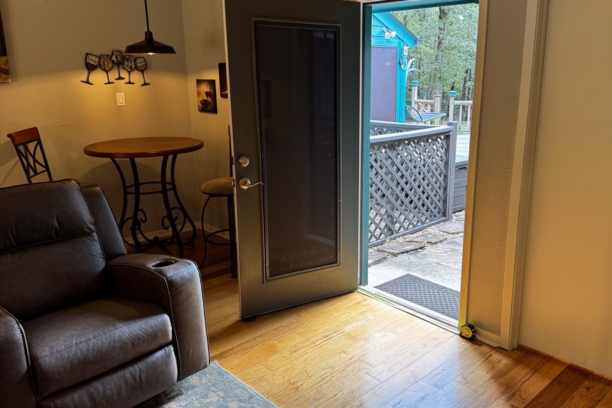 Door in the living room that leads to outside.