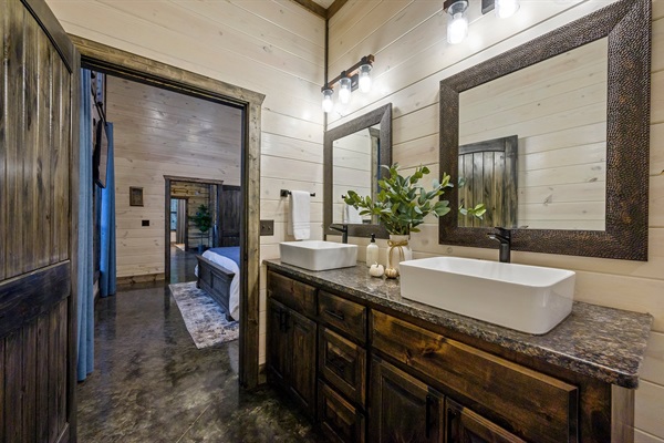 Sleek designer bathroom featuring high-end finishes and rustic charm.