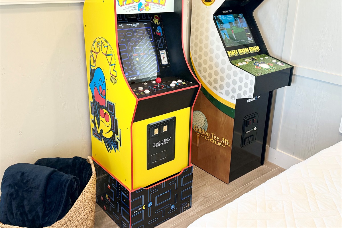 Arcade games in downstairs bedroom.