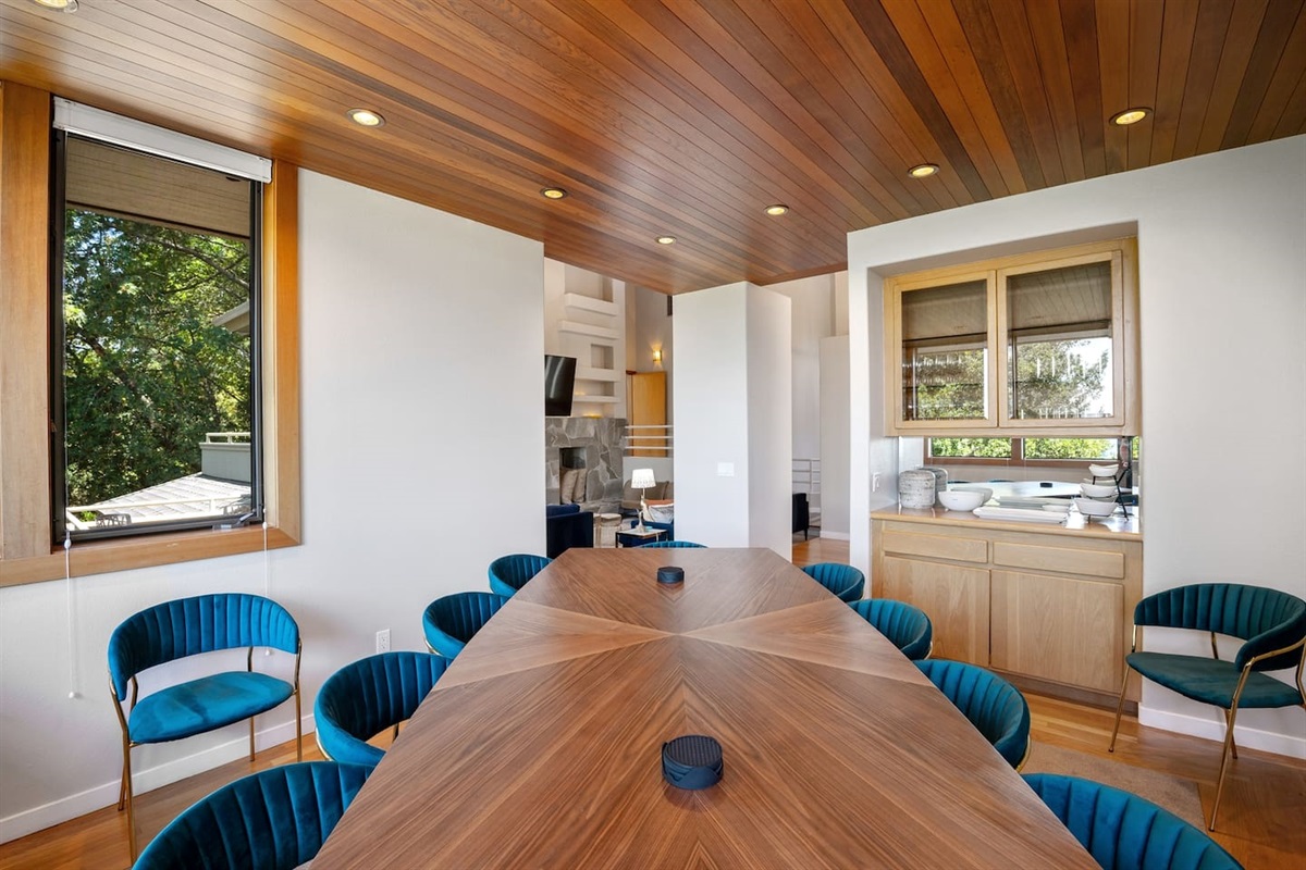 12-person dining room table. Serving dishes. Wine, champagne, and old fashioned glasses service for 16.