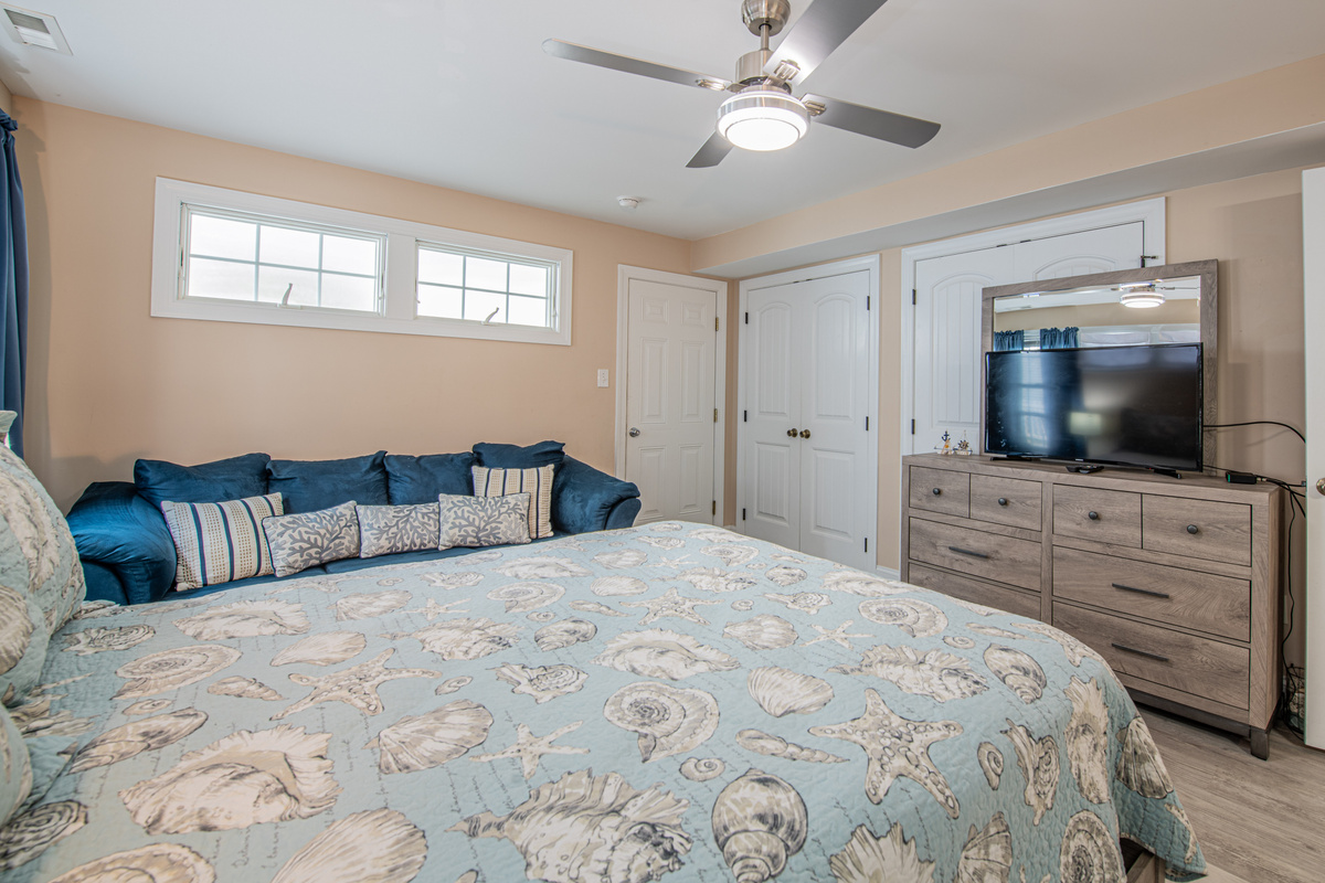 Bedroom 2 View Showing Seashell Quilt, Blue Sofa