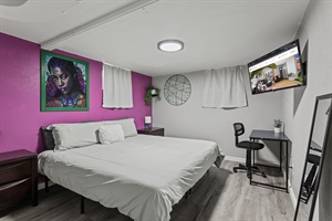 Enjoy the fusion of business comfort with a king-sized bed, a dedicated workspace, and a smart TV for unwinding.