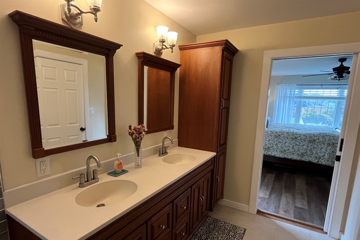 Primary bath with jetted tub and frameless glass shower