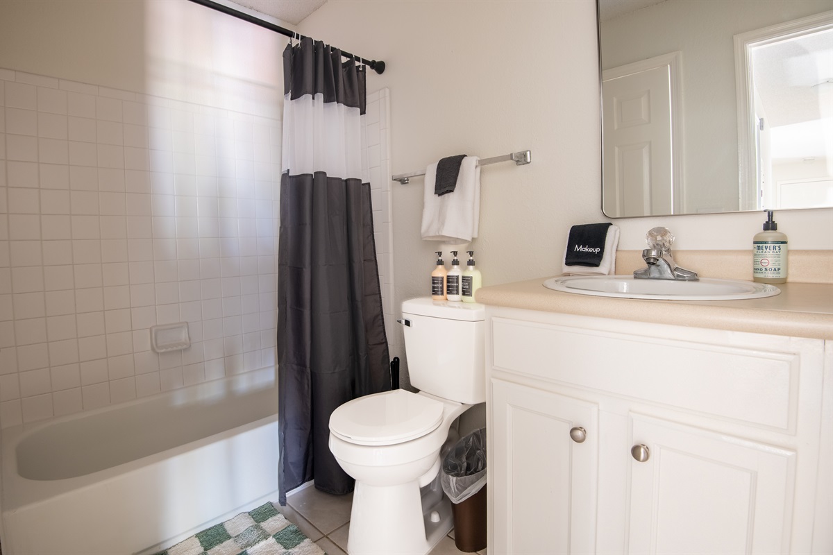 This is the bright, thoughtfully appointed hallway bathroom designed for comfort and ease