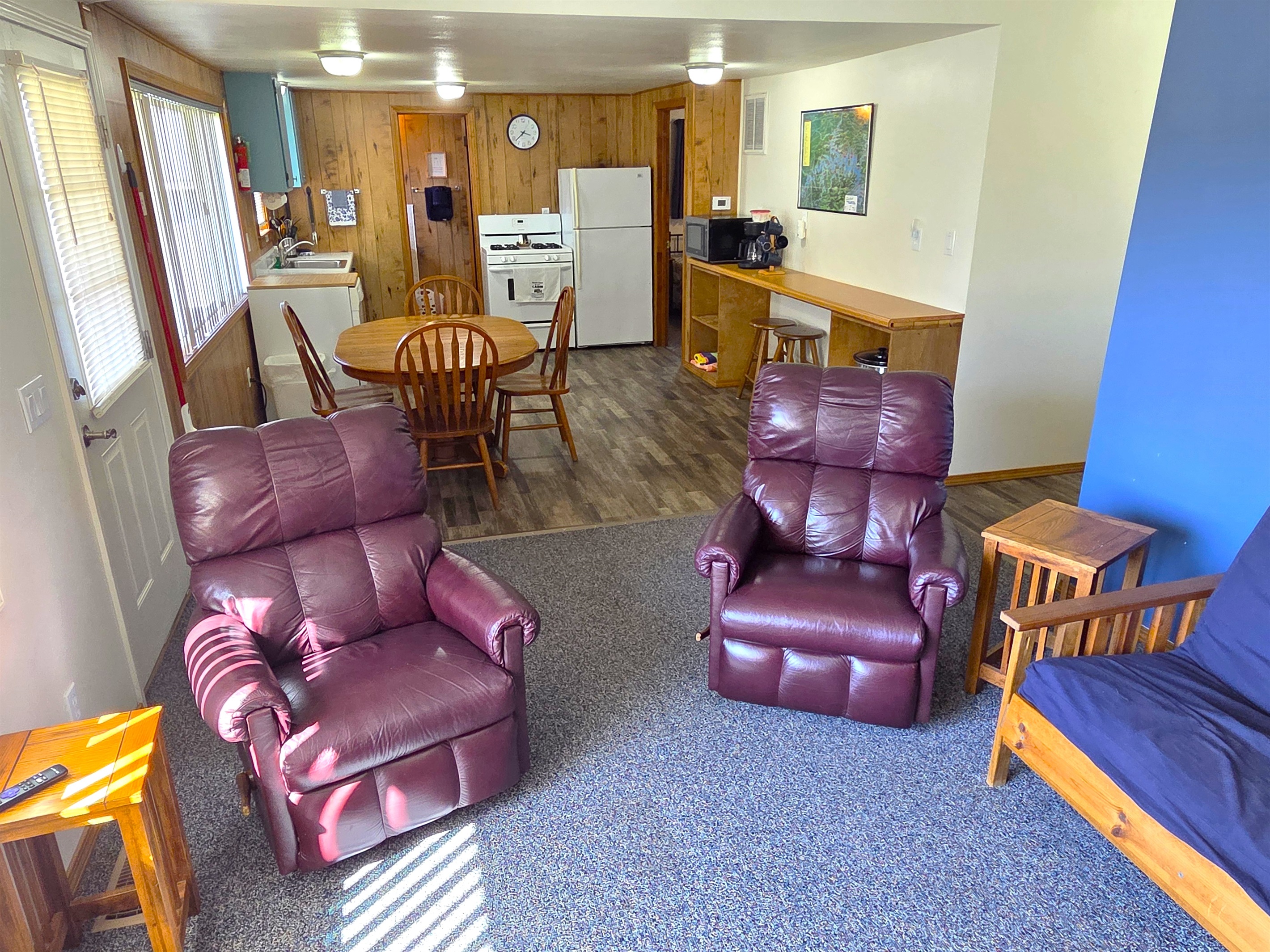 Relax in the recliners and enjoy the open area between the kitchen and living room.