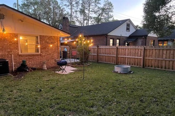 Backyard area with lights that come on at night.