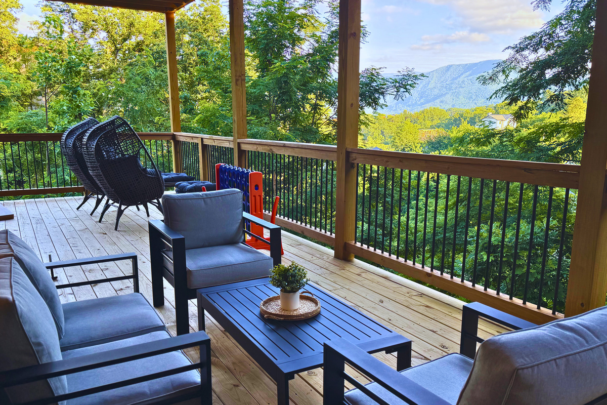 Your front-row seat to the Smokies. Unwind on the spacious covered lower deck with comfortable seating, mountain views, and plenty of room to enjoy your morning coffee or evening conversation.