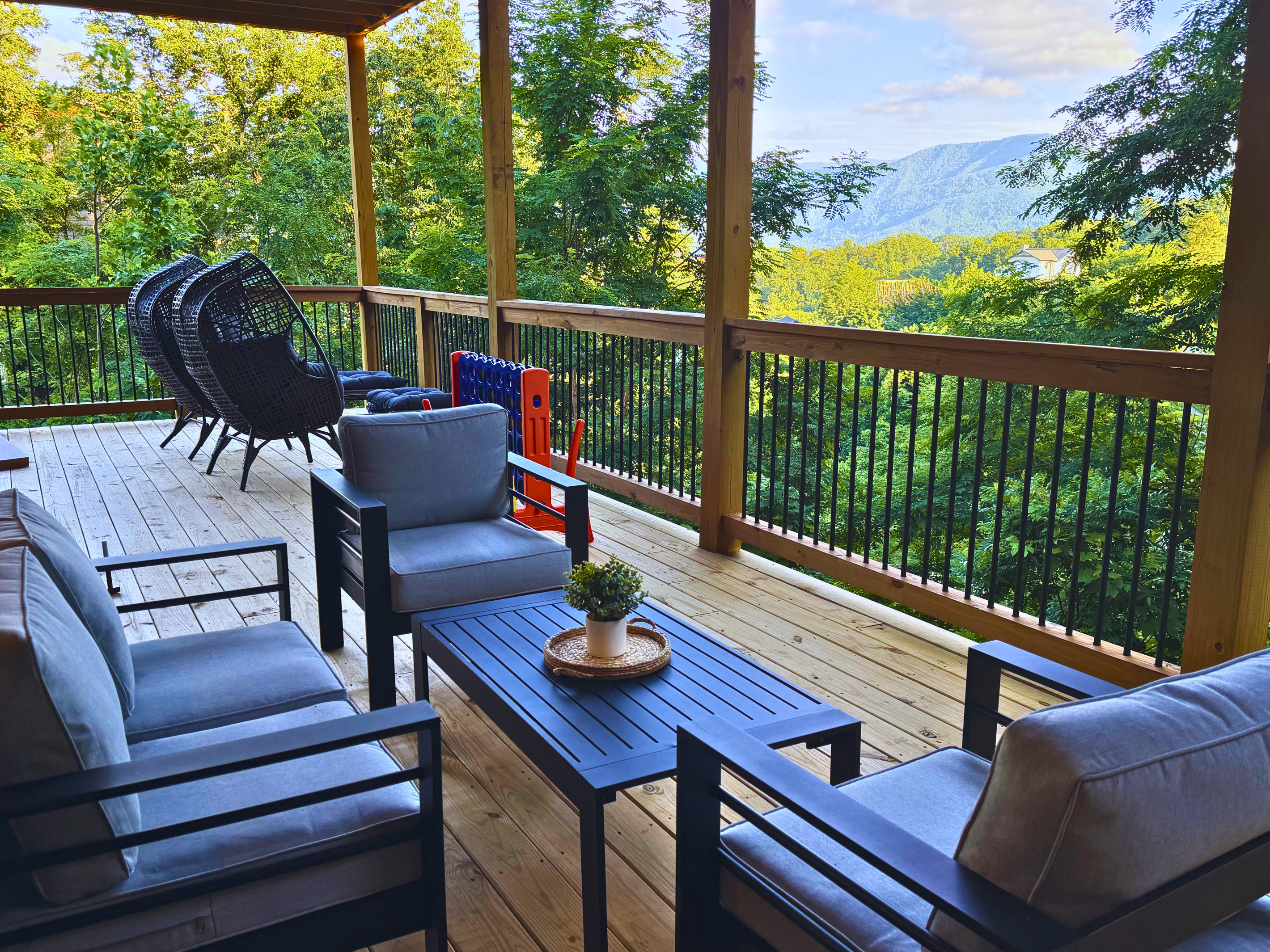 Your front-row seat to the Smokies. Unwind on the spacious covered lower deck with comfortable seating, mountain views, and plenty of room to enjoy your morning coffee or evening conversation.