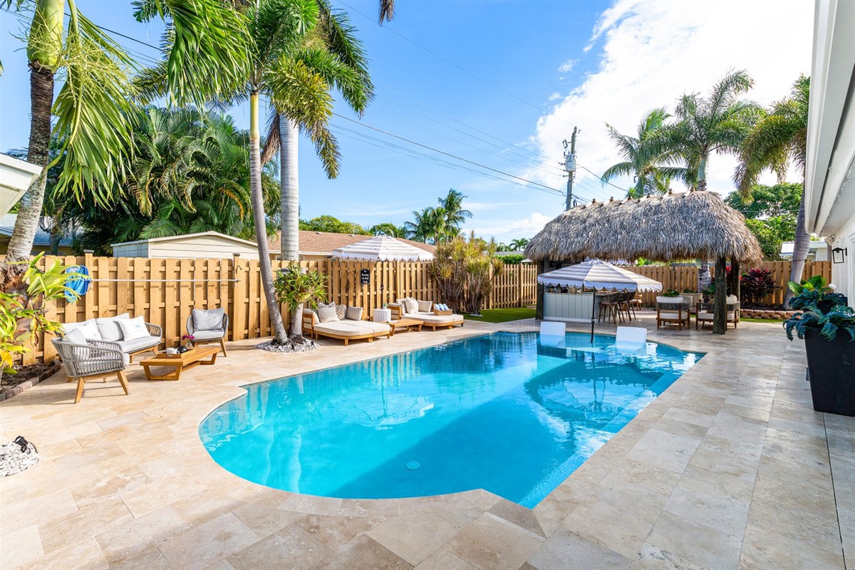 Outdoor Oasis: Relax under the tiki hut, soak in sunsets, and enjoy the sparkling pool!