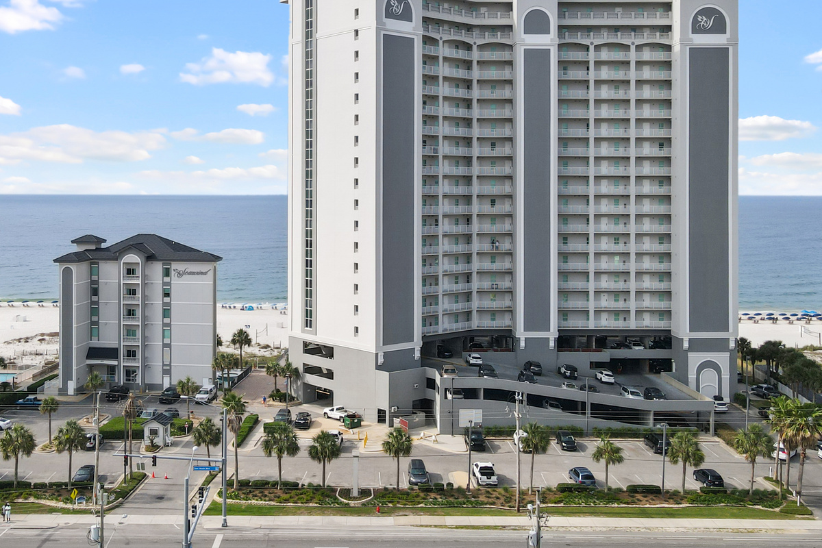 Arrival landmark: Use the tall Seawind tower on the right, which includes the parking garage. The shorter Seawind building is shown on the left only for comparison.