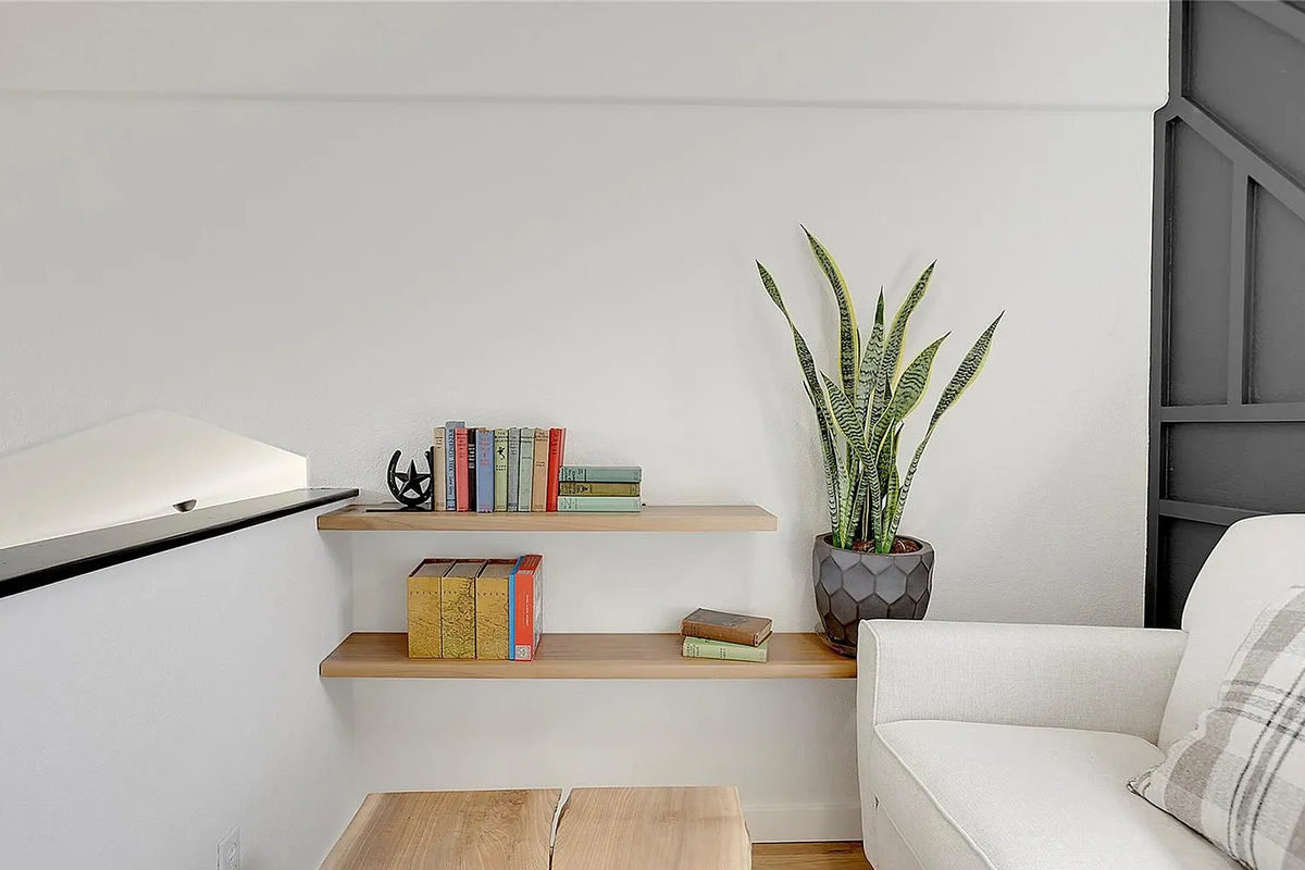 A quiet, sunlit corner dedicated to curling up with a good book or enjoying a peaceful moment.