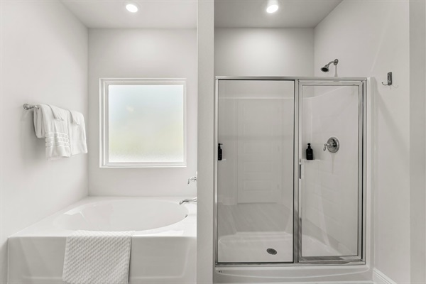 Soaking tub and shower with all toiletries and towels needed.