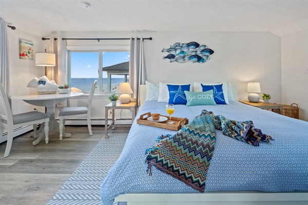 This second-floor bedroom includes a charming sitting area and table!