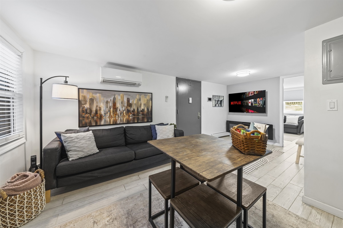 Settle in for movie nights, good conversation, or quiet downtime in a living room designed for easy city living.