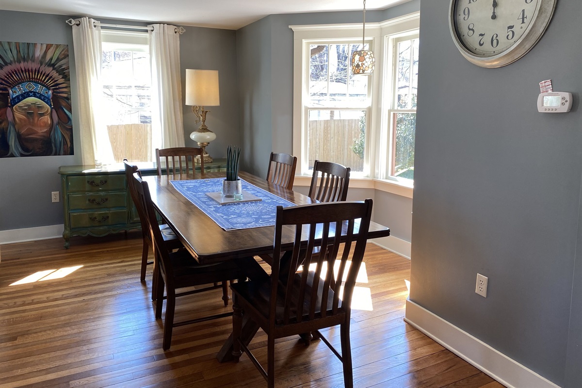 Large dining table comfortably seats 8 for sharing meals with your company