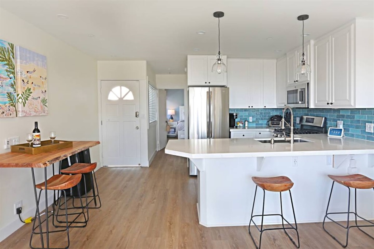 There is seating for four at the table along the left side but also a breakfast bar and seating on the balcony.