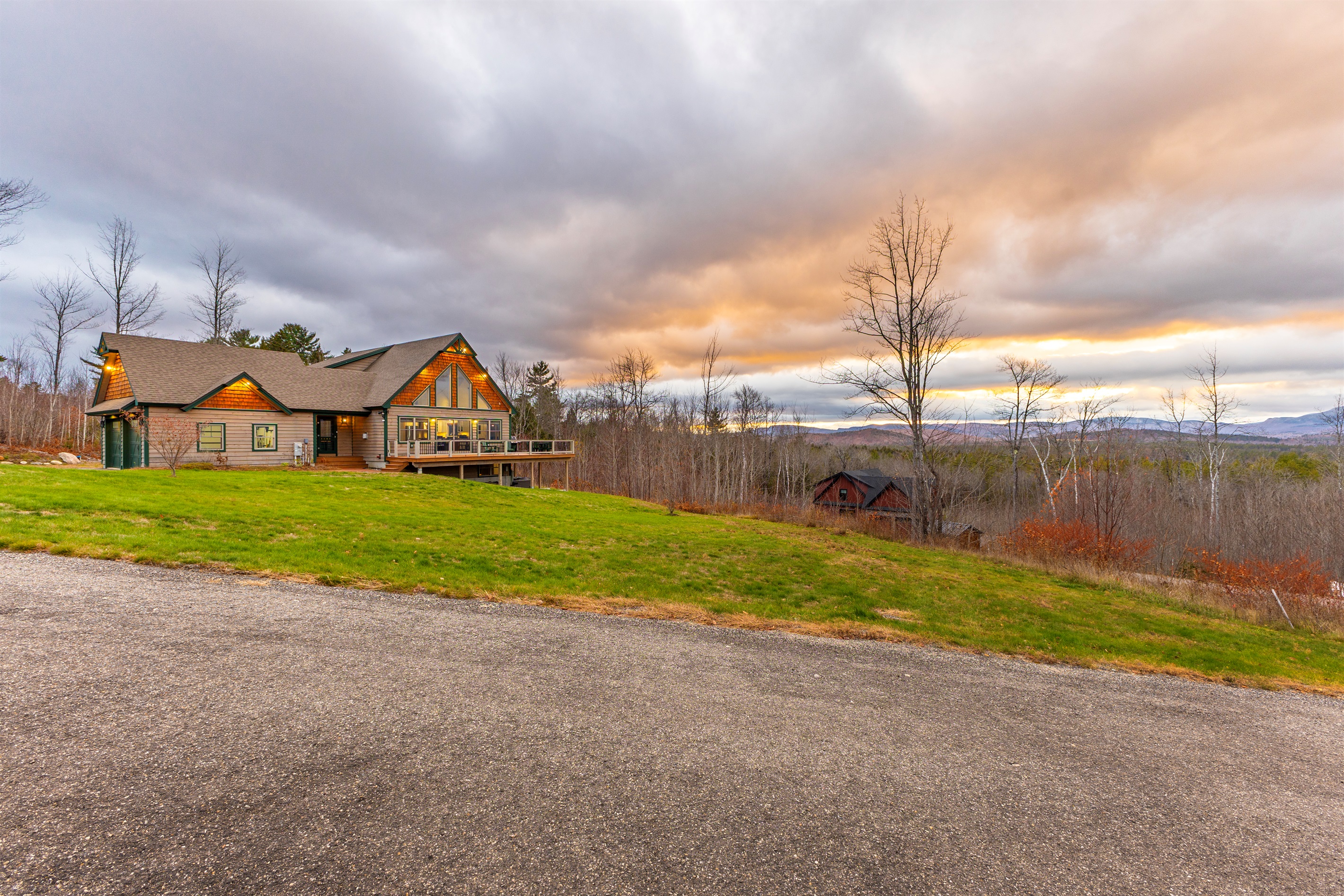 Experience the lodge’s inviting exterior and breathtaking mountain views.