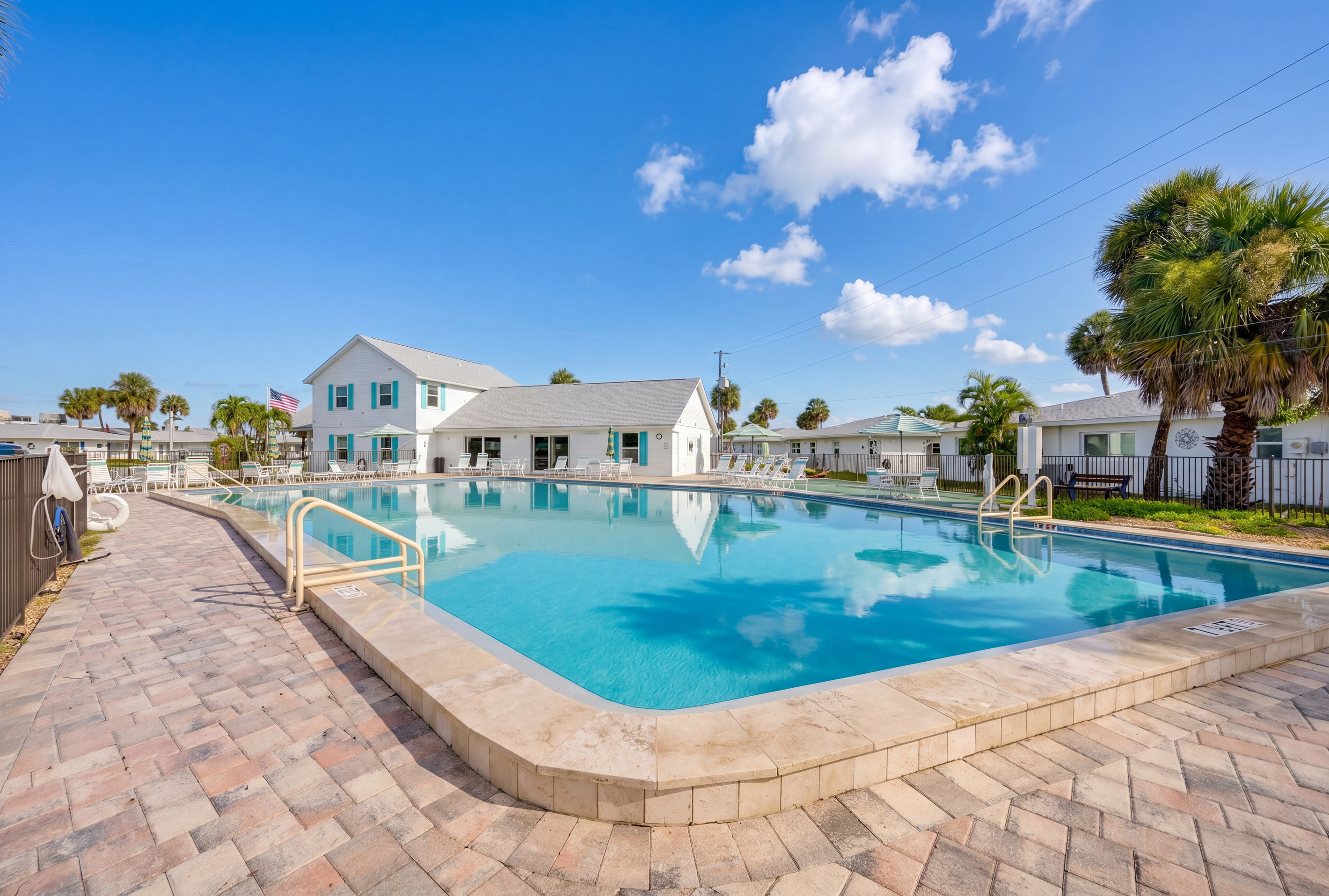 The large heated community pool is perfect for a refreshing swim or a relaxing afternoon in the Florida sunshine.

