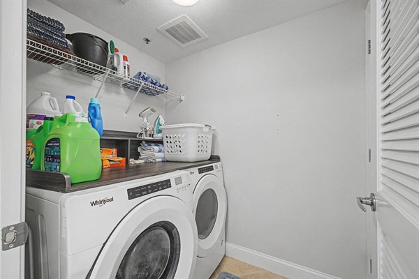 Washer and dryer conveniently located in condo, iron and steamer also.