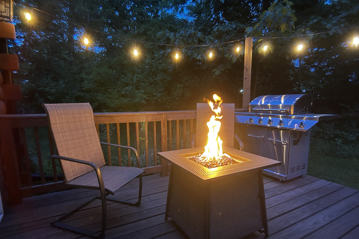 Relax by the fire table while your food cooks on the propane grill.