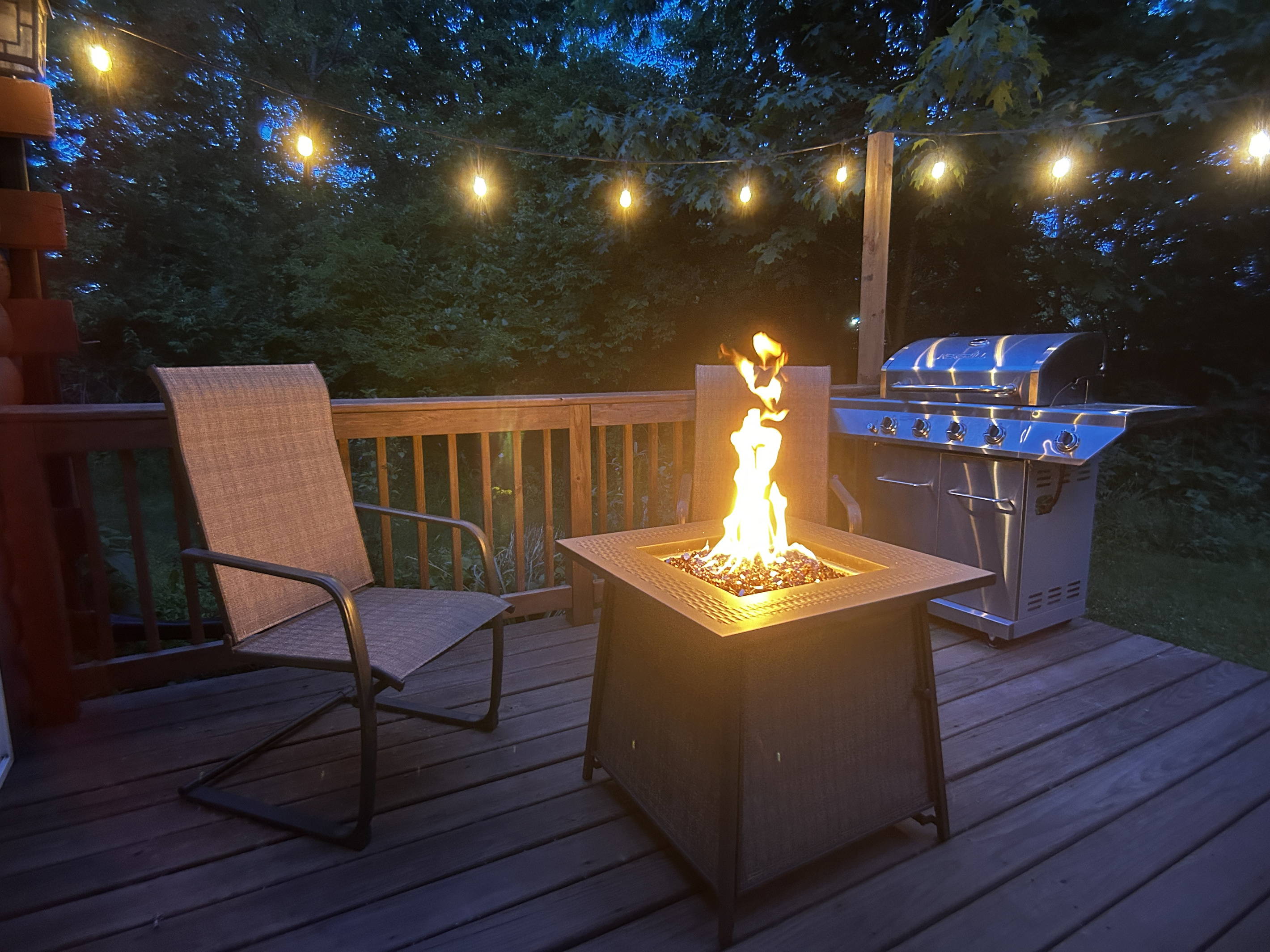 Relax by the fire table while your food cooks on the propane grill.