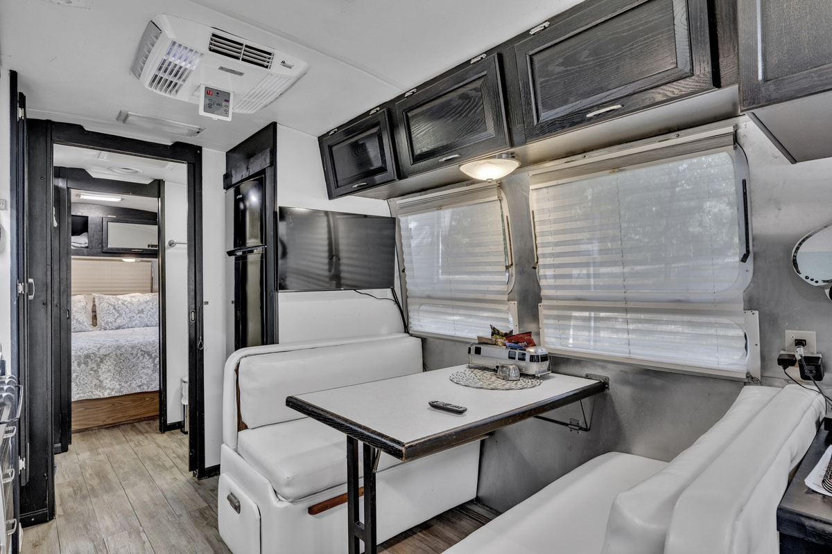 Built-in dinette offers a comfortable spot for meals, games, or planning the day