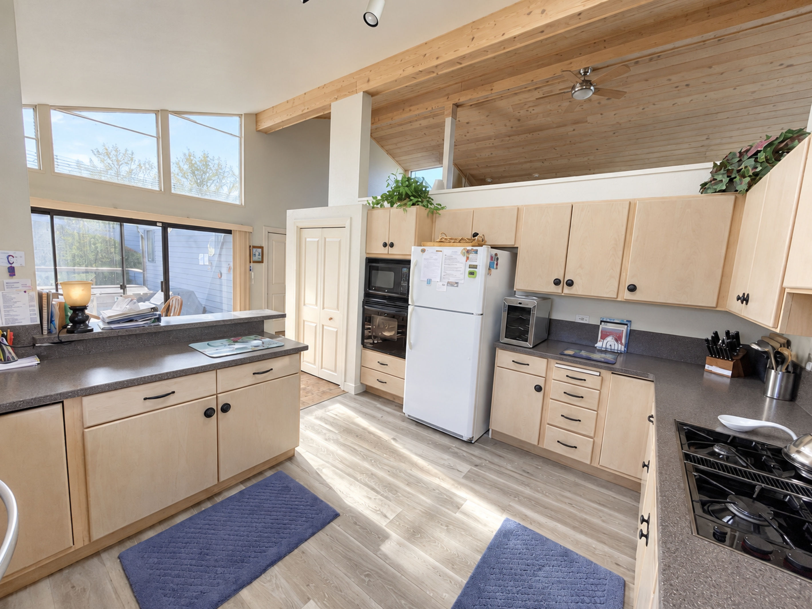 Appliances facing towards dining and patio area with barbecue and hot tub