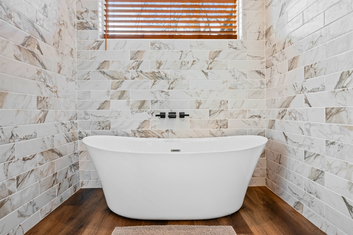 Soaking in this deep tub is the perfect way to slow down, relax your muscles, and end the day on a peaceful note.