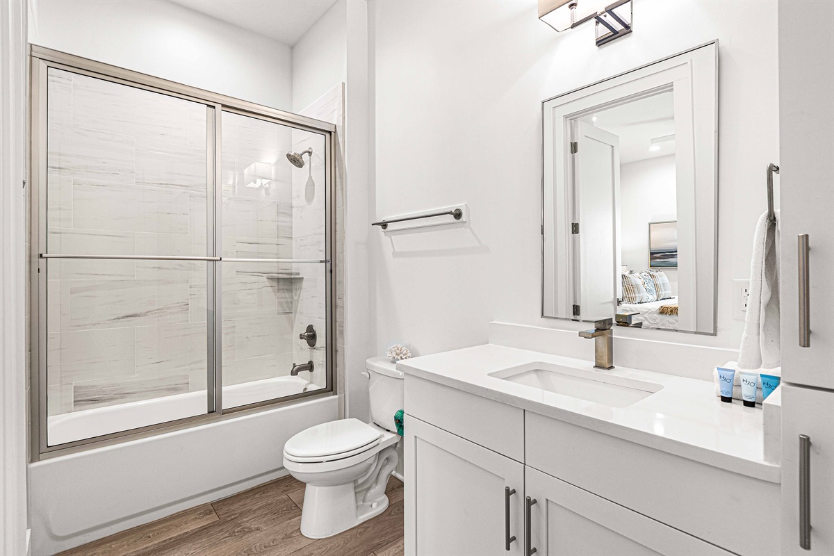 EnSuite Bathrooms for every bedroom make getting ready so easy, offering tons of privacy as well.Main Level Bathroom is en-suite to the Main Level Primary Bedroom. Plenty of storage and towels.