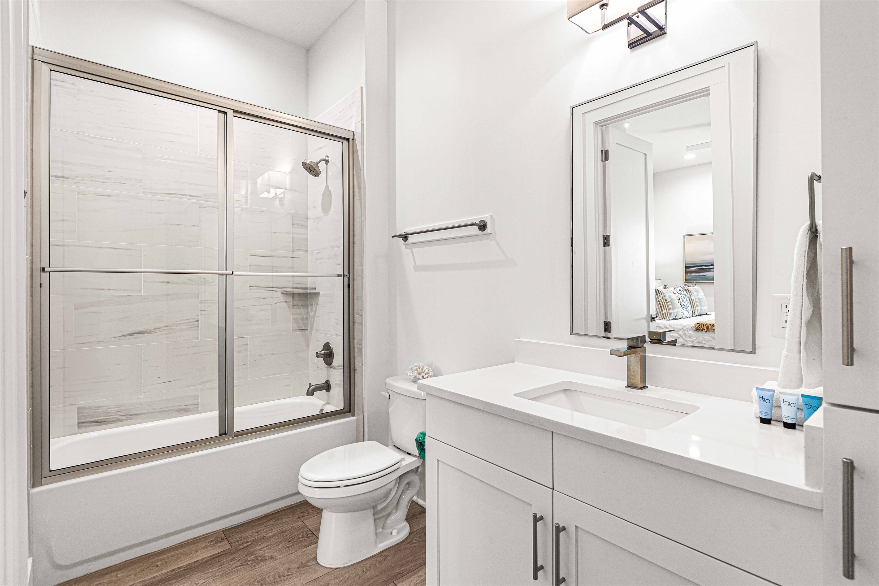 EnSuite Bathrooms for every bedroom make getting ready so easy, offering tons of privacy as well.Main Level Bathroom is en-suite to the Main Level Primary Bedroom. Plenty of storage and towels.