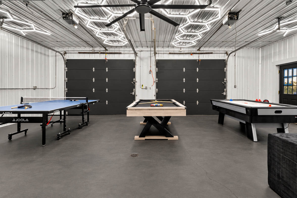 Spacious recreation room with multiple game tables