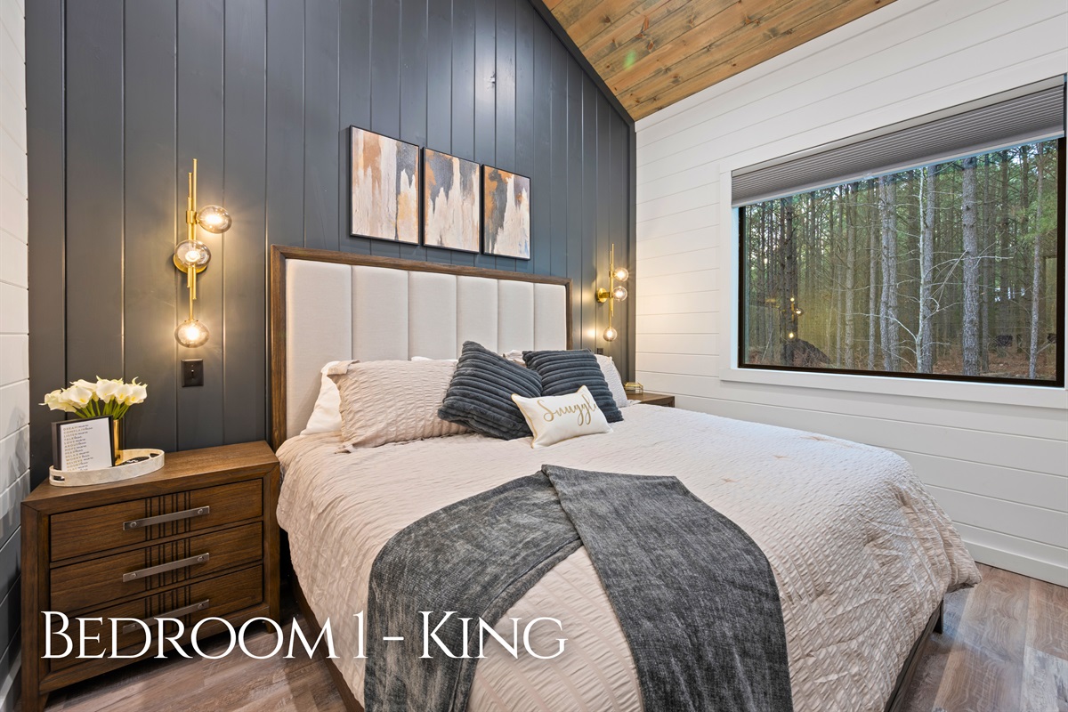 Soft lighting, calming tones, and a plush king bed create a peaceful retreat where you can unwind comfortably after a day of exploring the area.