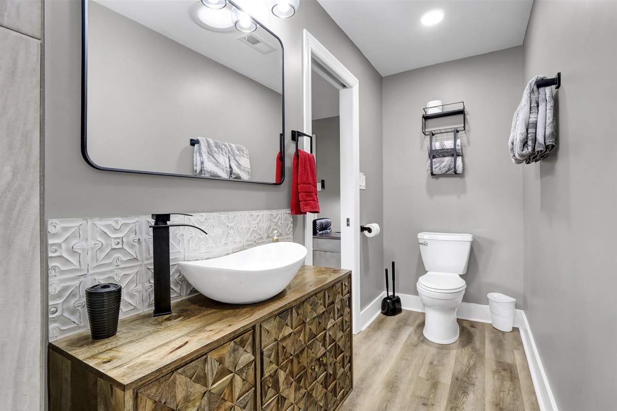 The beautifully renovated bathroom offers all the modern comforts of home.