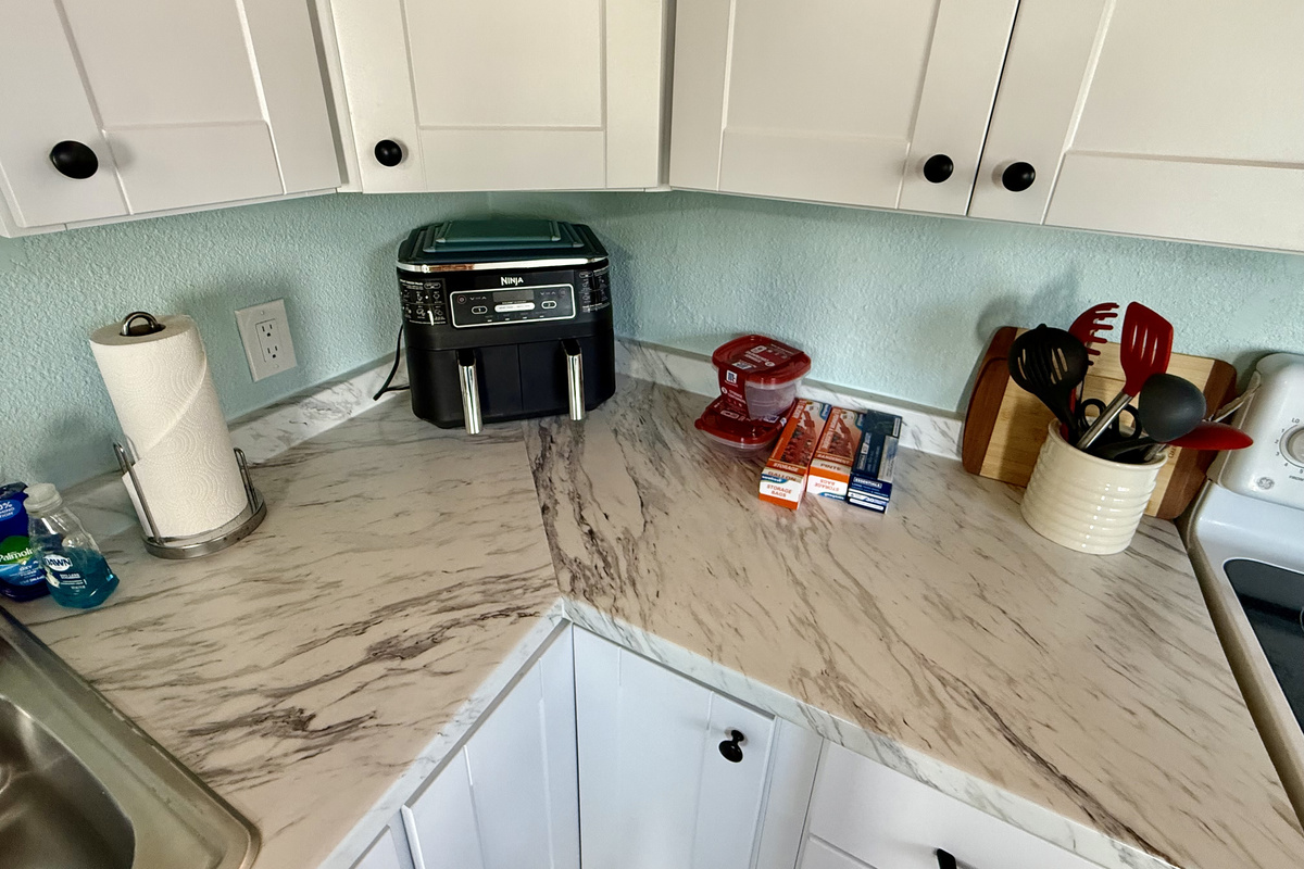 Gorgeous marble counter tops with all the kitchen necessities