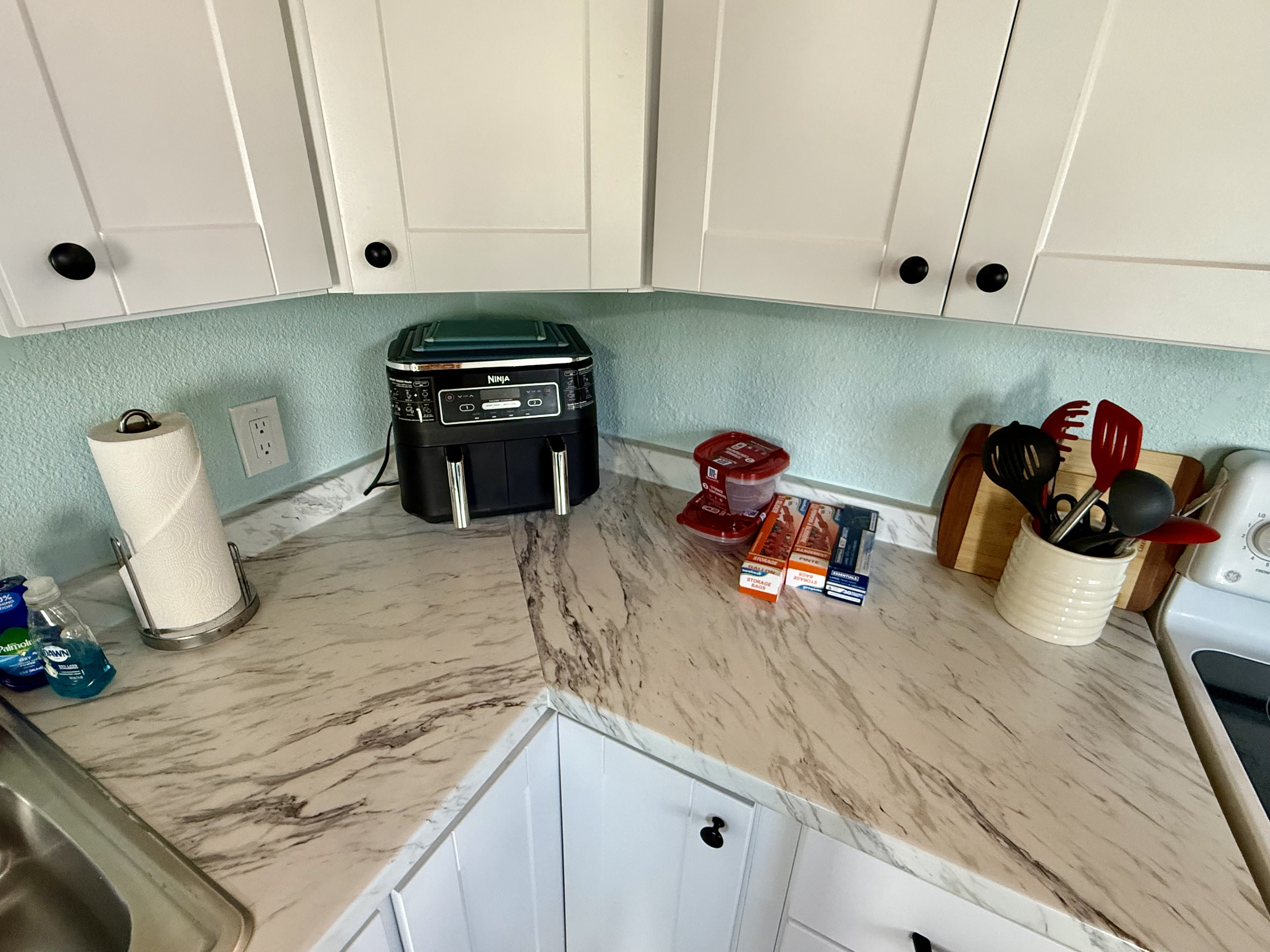 Gorgeous marble counter tops with all the kitchen necessities