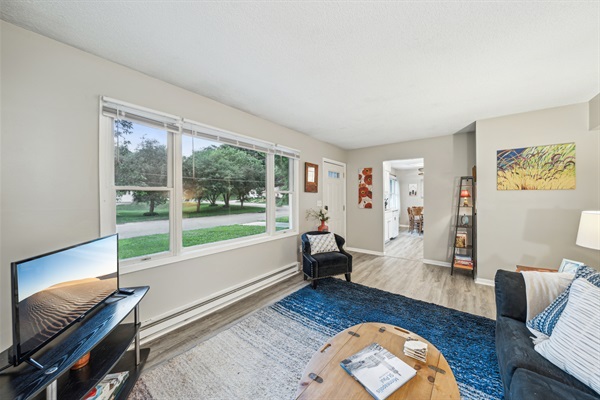 The living room overlooks the charming Stillwater neighborhood.
