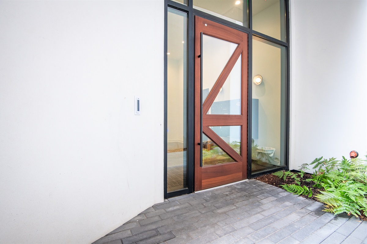 Contemporary glass entryway offering a stylish welcome