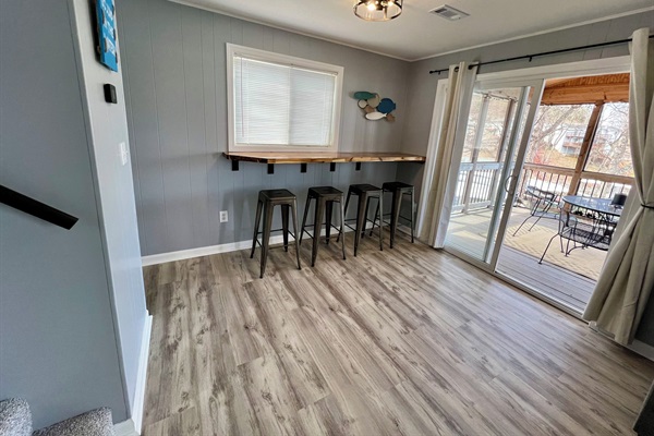 Bar top dining near the screened-in deck.
