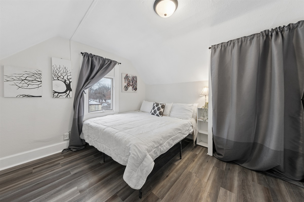 The upstairs king bedroom overlooks the backyard.