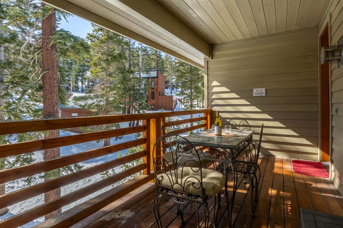 Comfortable balcony seating with mountain views—an inviting spot to unwind.