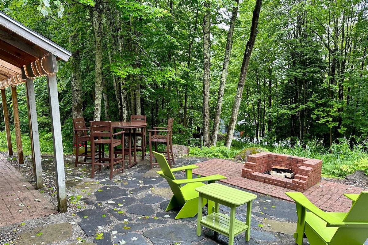 Cozy outdoor space with plentiful seating and a firepit for your use!